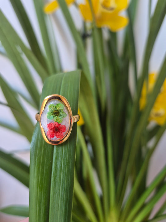 Anillo ajustable ovalado dorado flores