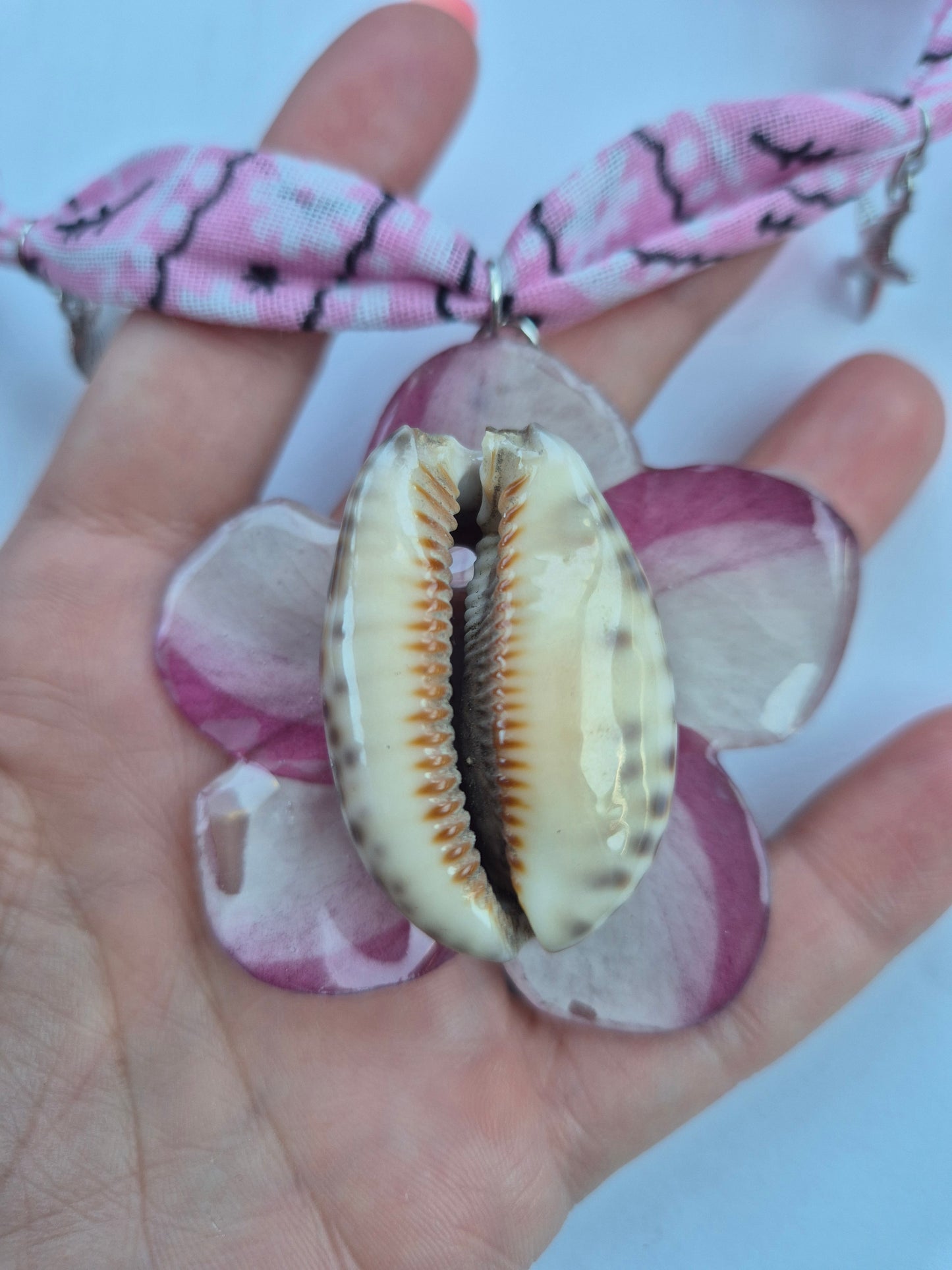 Colgante caracola y plumeria